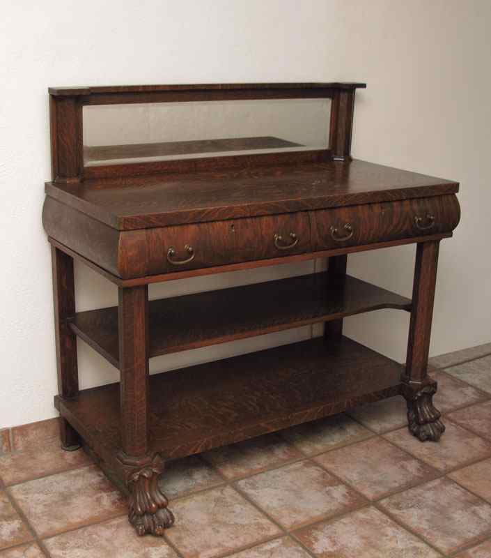 Appraisal: LATE VICTORIAN ERA TIGER OAK PAW FOOT SIDEBOARD Mirror backsplash