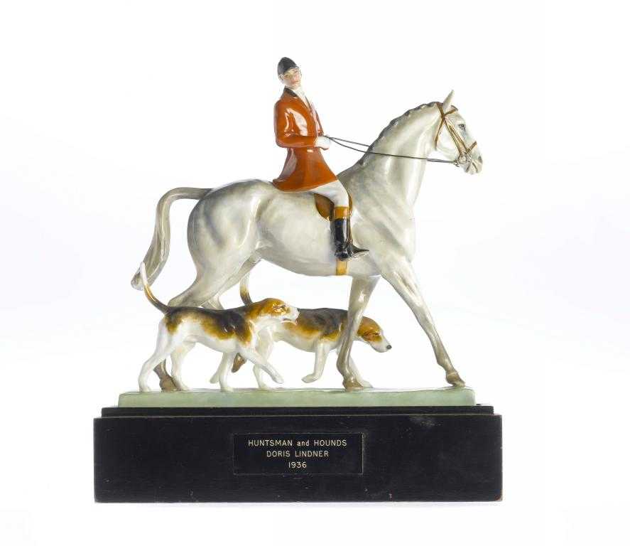 Appraisal: A ROYAL WORCESTER EQUESTRIAN GROUP OF A HUNTSMAN AND HOUNDS