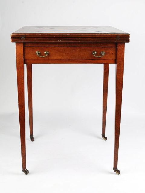 Appraisal: AN EDWARDIAN MAHOGANY ENVELOPE CARD TABLE with four quarter flaps