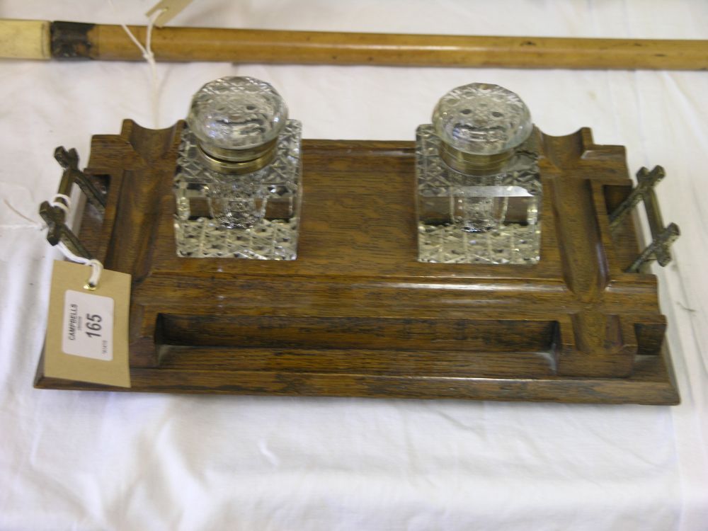 Appraisal: A late Victorian oak desk stand with brass handles pen