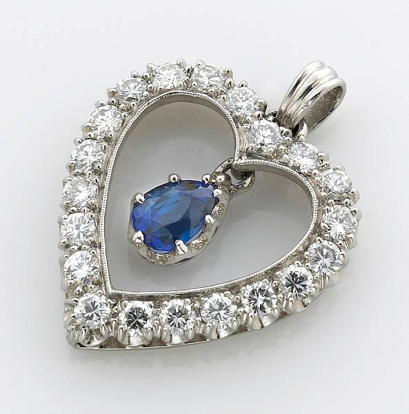 Appraisal: A sapphire diamond platinum and k white gold pendant with