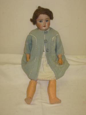 Appraisal: A Schoenau and Hoffmeister bisque head girl doll with blue