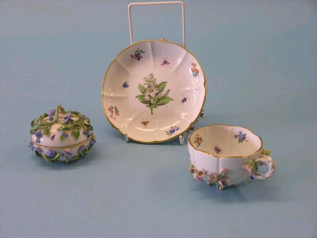 Appraisal: A Meissen cabinet cup and saucer floral-encrusted with painted flowers