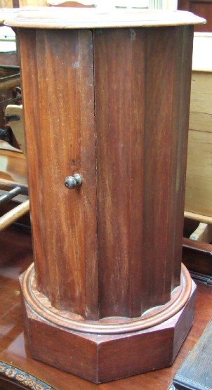 Appraisal: A th century mahogany pot cupboard with fluted column raised