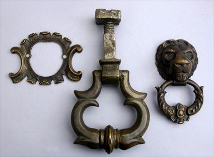 Appraisal: TWO RENAISSANCE-STYLE BRONZE DOOR PULLS One cast as a lion