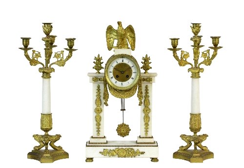 Appraisal: A French three-piece clock garniture the clock surmounted by an