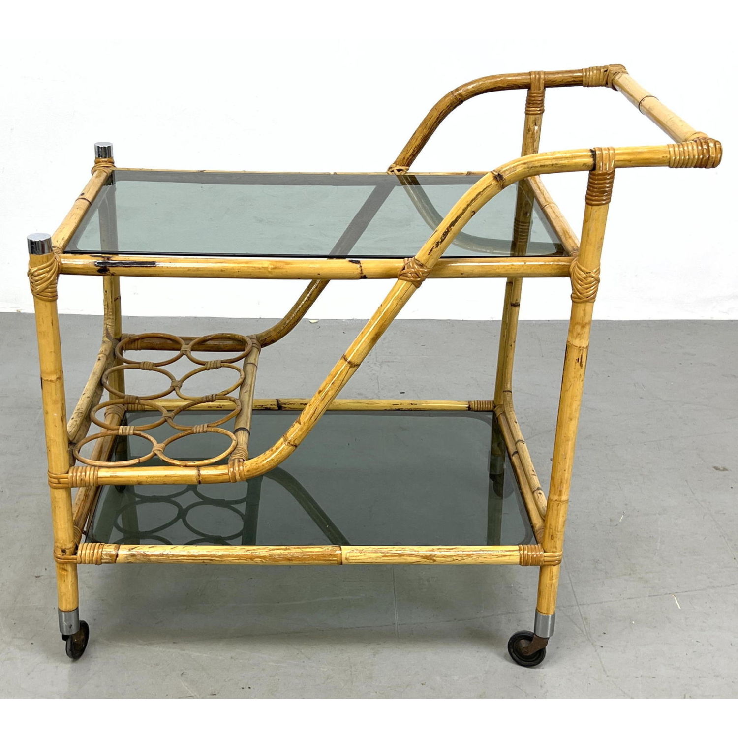 Appraisal: French style Rattan Serving Bar Rolling Cart Two Topaz Glass