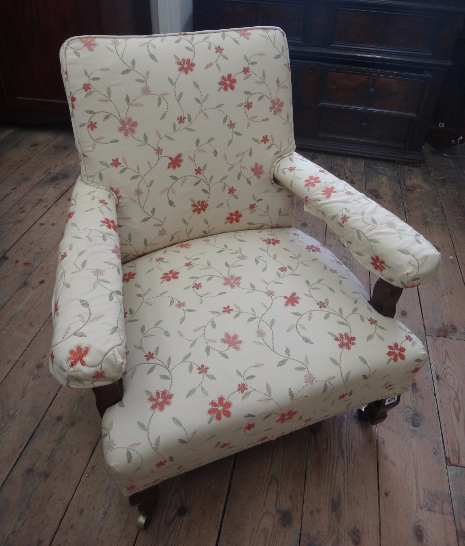 Appraisal: A late Victorian walnut frame upholstered armchair on shaped tapering