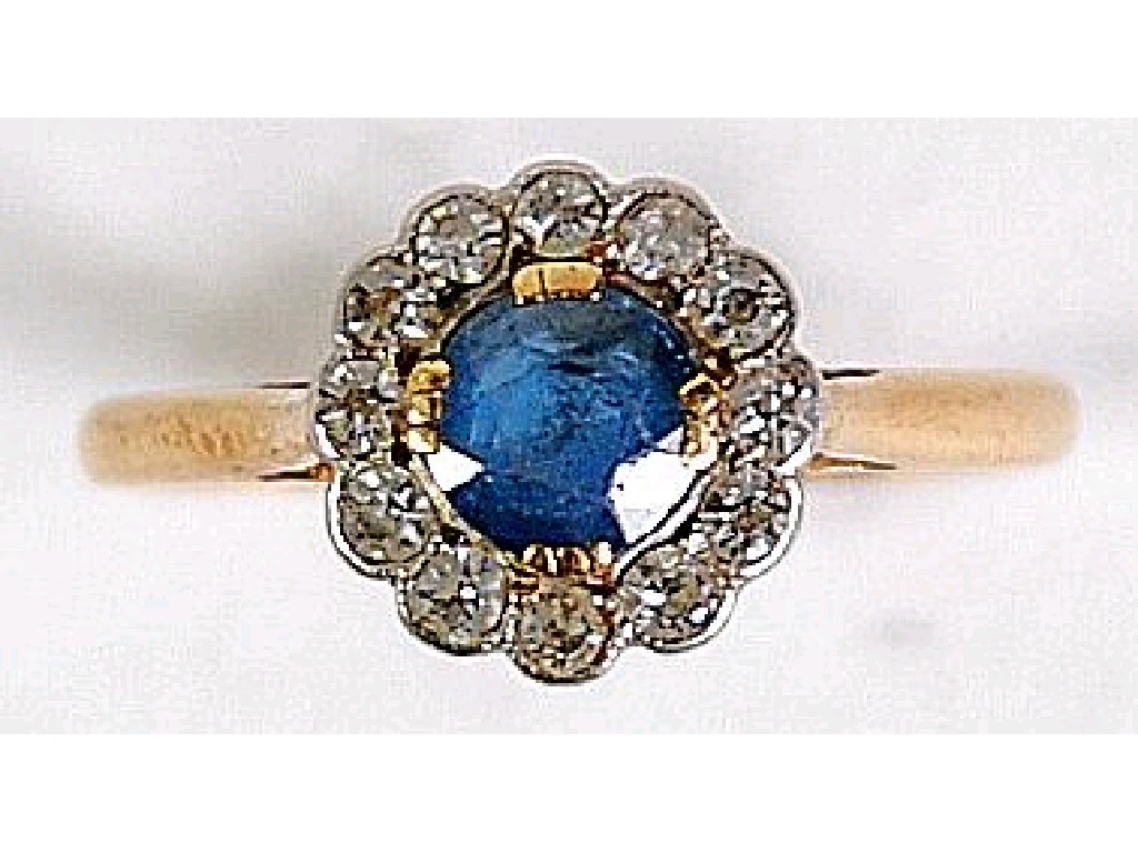 Appraisal: ct GOLD SAPPHIRE AND DIAMOND CIRCULAR CLUSTER RING set with