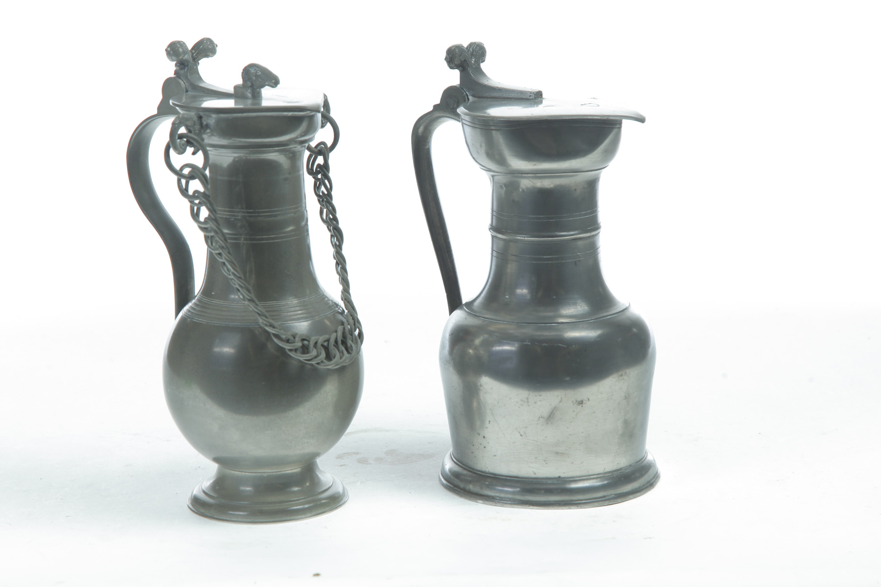 Appraisal: TWO SWISS PEWTER FLAGONS th- th century Similar forms The