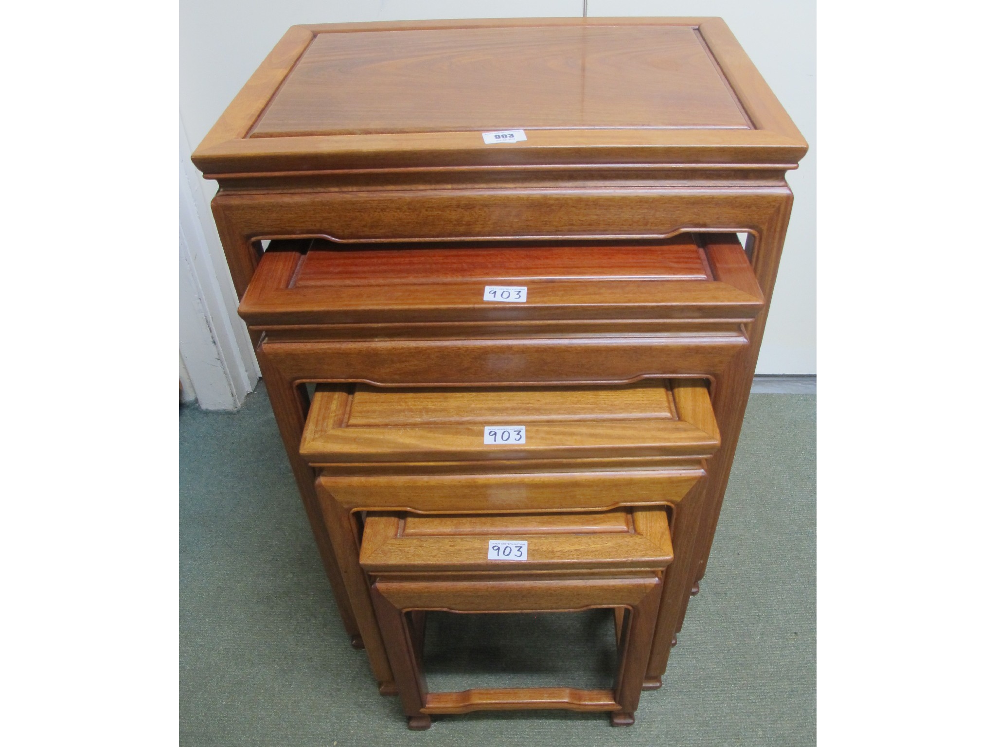 Appraisal: A nest of four teak tables