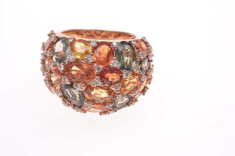 Appraisal: A MULTI COLOURED SAPPHIRE BOMBE RING WITH DIAMOND DETAIL IN