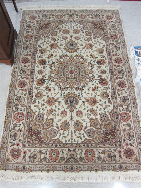 Appraisal: HAND KNOTTED ORIENTAL AREA RUG Pakistani-Persian floral and central floral