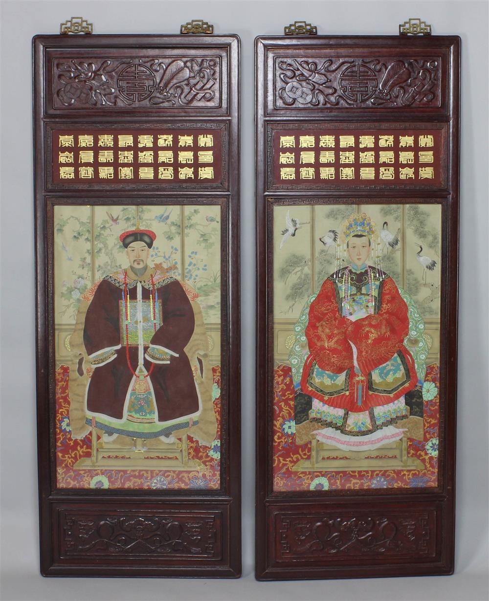 Appraisal: PAIR OF CHINESE ANCESTOR PORTRAITS IN CARVED WOOD FRAMES painted