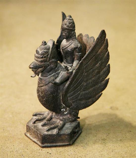 Appraisal: STATUE OF A DEITY ON A BIRD Asian late th-early