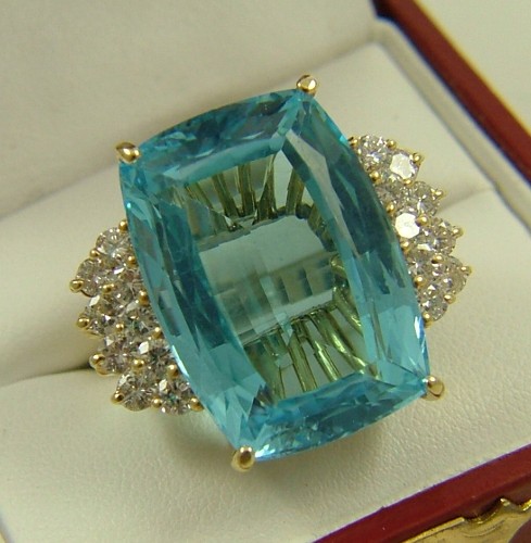 Appraisal: BLUE TOPAZ AND DIAMOND DINNER RING K yellow gold estimated