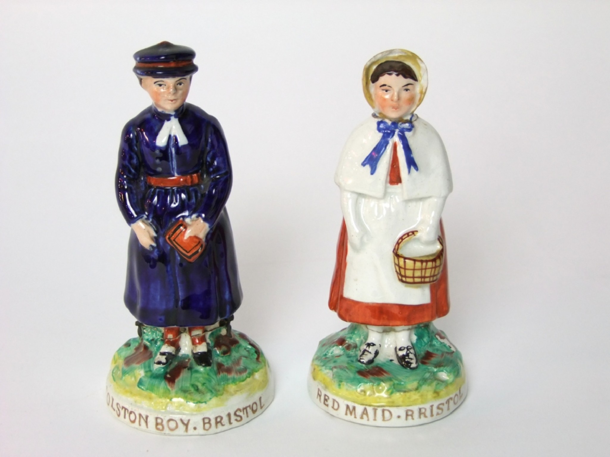 Appraisal: A pair of late th century Staffordshire figures of a