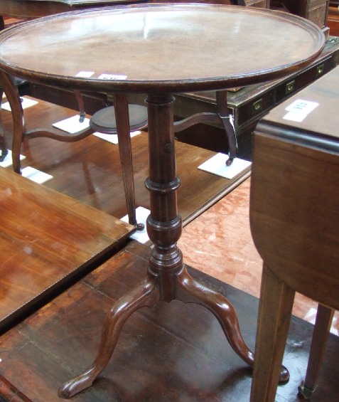 Appraisal: An early th century mahogany snap top occasional table the