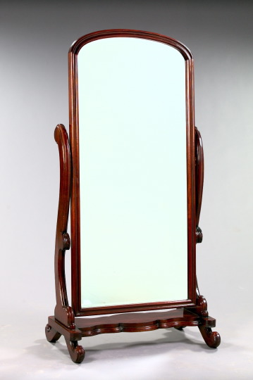 Appraisal: Regency-Style Mahogany Cheval Mirror the arched and molded mirror supported