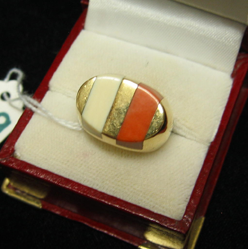 Appraisal: CORAL IVORY AND FOURTEEN KARAT GOLD RING set with two