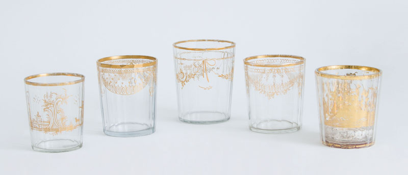 Appraisal: FIVE CONTINENTAL GILT-DECORATED FACETED-GLASS TUMBLERS One with hunter and mountain