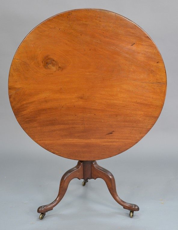 Appraisal: Mahogany tip table on urn turned shaft set on tripod