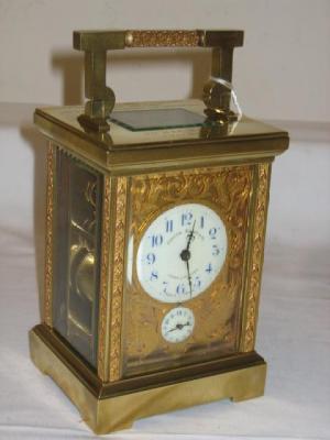 Appraisal: A FRENCH CARRIAGE CLOCK the twin barrel movement with lever