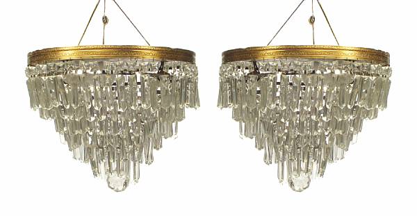 Appraisal: A group of two Empire style brass and glass chandeliers