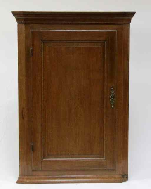 Appraisal: A th Century corner cupboard with moulded cornice and fielded