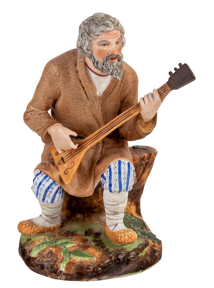 Appraisal: A RUSSIAN PORCELAIN FIGURE OF A SEATED BALALAIKA PLAYER POPOV