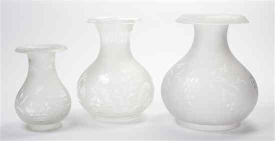 Appraisal: Three Frosted and Etched Glass Hurricane Shades of varying sizes