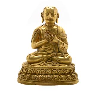 Appraisal: A Gilt-Bronze Figure of a Lama Seated in vajraparyanka on