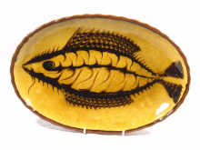 Appraisal: British Studio Pottery An oval ceramic dish with slip ware