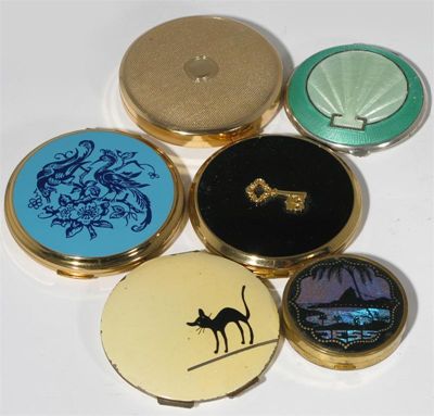 Appraisal: Six various compacts including an enamelled black cat an enamelled