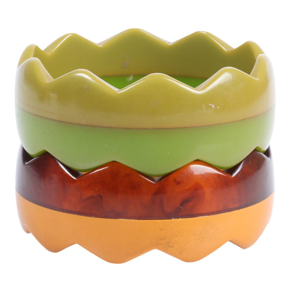 Appraisal: TWO LAMINATED BAKELITE ZIGZAG BANGLE BRACELETS H X INNER DIAM