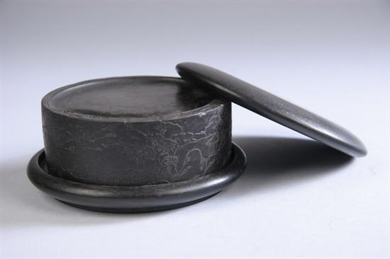 Appraisal: CHINESE INKSTONE Circular form with bat peach and riverscape decoration