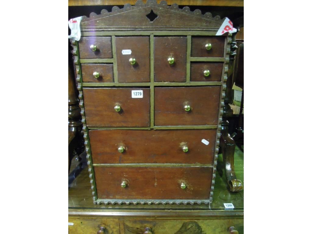 Appraisal: A stained pine and mahogany table top chest cabinet in