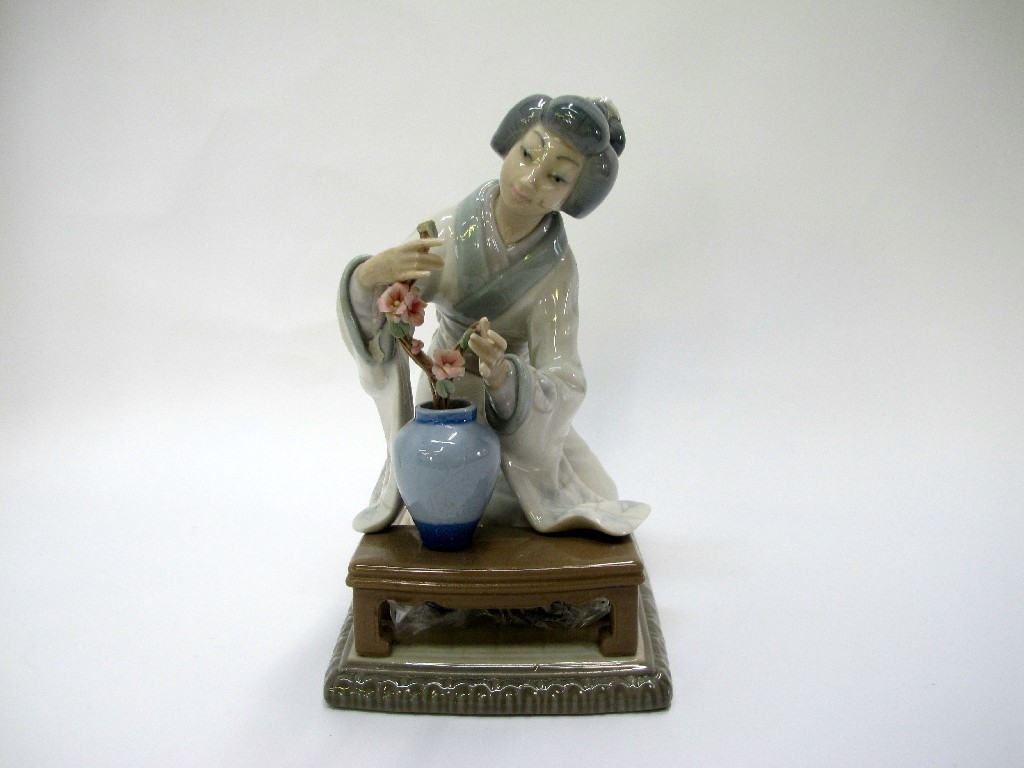 Appraisal: Lladro figure Japanese lady tending flowers def