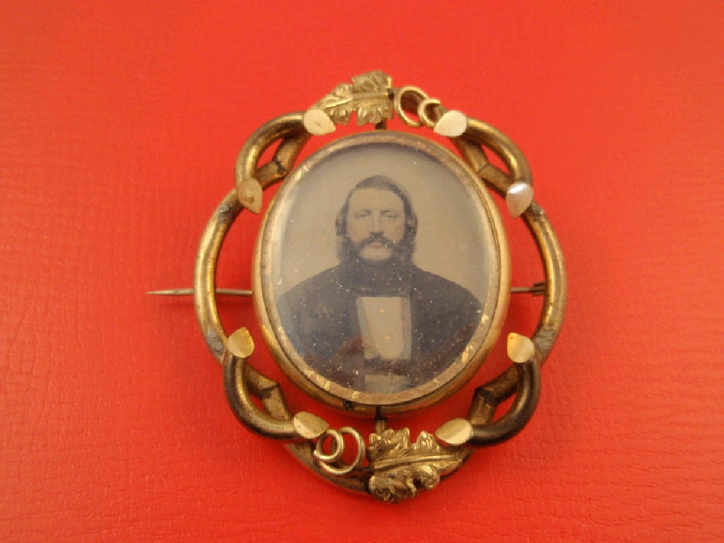 Appraisal: A large Victorian memorial brooch hair insert verso photograph of