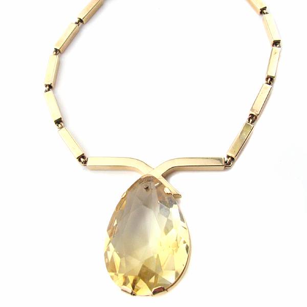 Appraisal: A large pear shaped citrine pendant and fourteen karat gold