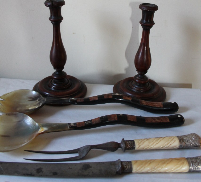 Appraisal: A pair of walnut treen candlesticks a pair of candlesticks