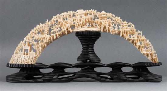 Appraisal: Chinese carved ivory tusk bridge intricate carving depicts village river