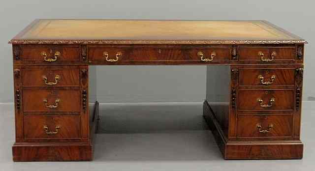 Appraisal: Massive mahogany partner's desk c with a tooled leather top