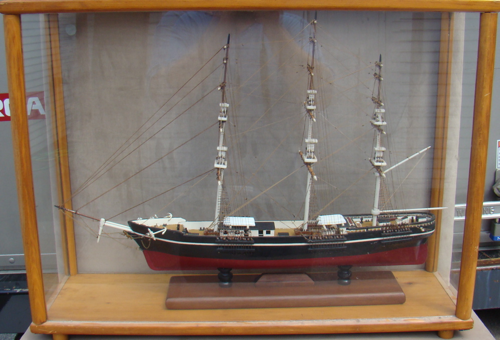 Appraisal: CASED MODEL OF A THREE-MASTED SHIP With black and red