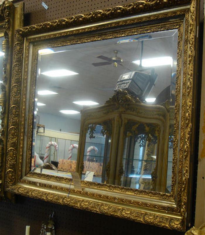 Appraisal: Ornate gilt framed wall mirror with beveled edge x Estimate