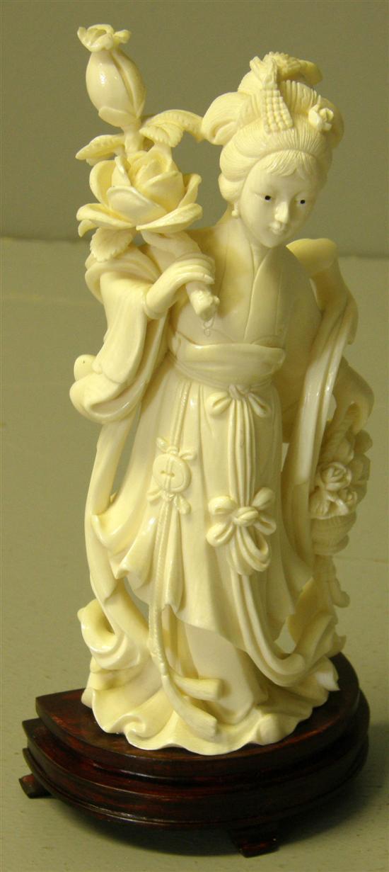 Appraisal: Chinese carved ivory figure of a girl with flowers h