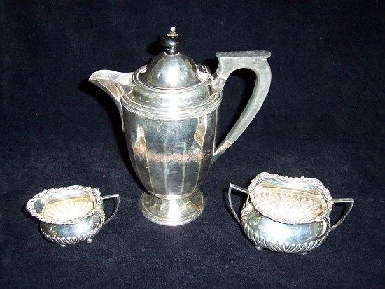 Appraisal: A cream jug and sugar basin of gadroon form on