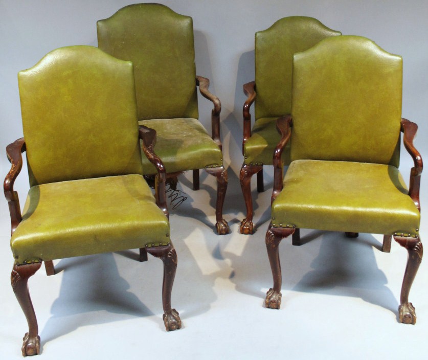 Appraisal: A set of four Harlequin green leather boardroom carver chairs