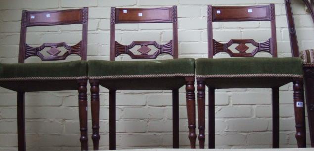 Appraisal: A set of four th century bar back dining chairs