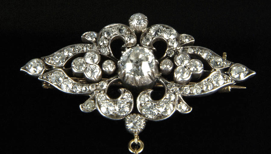 Appraisal: DIAMOND AND YELLOW GOLD BROOCH Silver topped k yellow gold